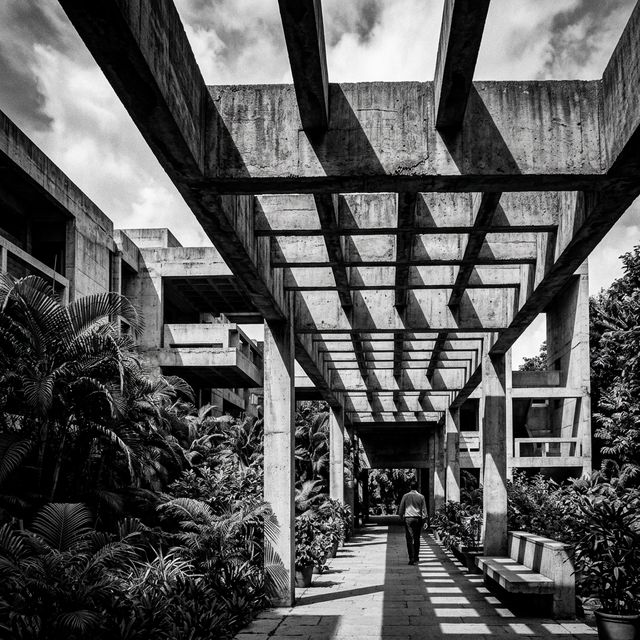 IIM Bangalore's deeply shaded stone and concrete corridors with rigorous geometric shadows